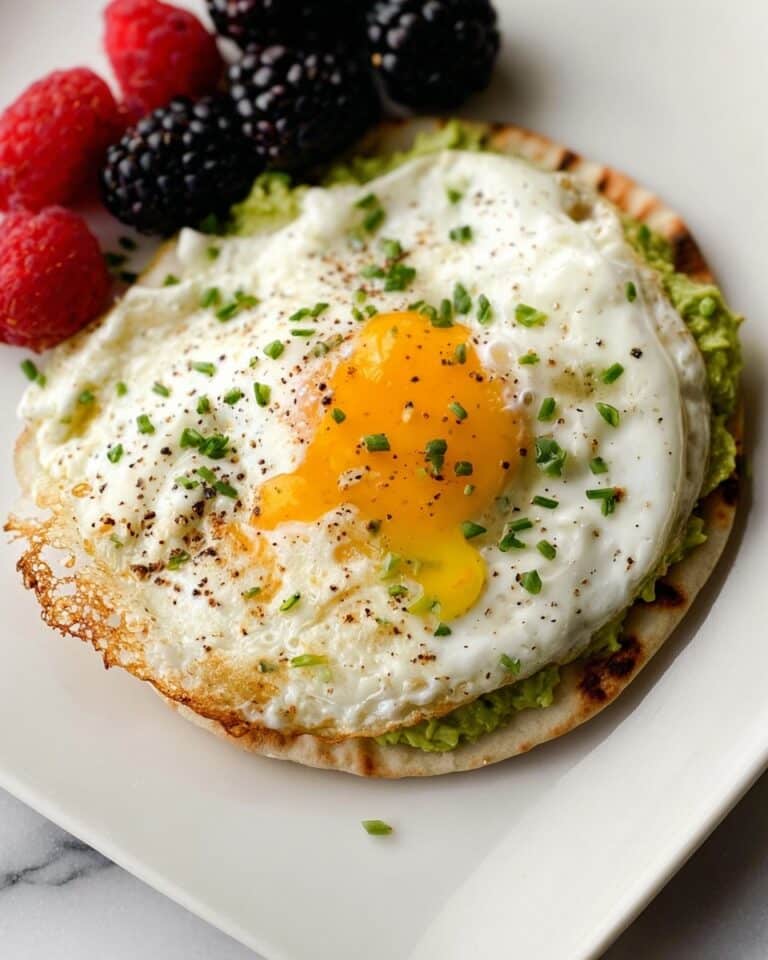 Crispy Feta Fried Egg on Toasted Tortilla with Avocado and Chives Recipe