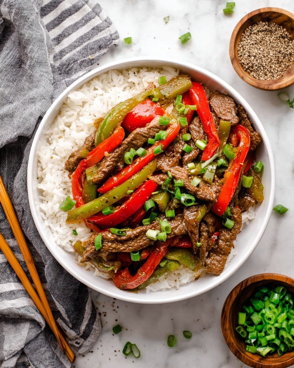 A white bowl filled with three main layers: the bottom layer is white rice with a soft, fluffy texture; the middle layer consists of sautéed red and green bell pepper strips, and thinly sliced brown beef strips cooked with a slight gloss of sauce; on top, small bright green chopped scallions are sprinkled evenly for garnish. The bowl sits on a white marbled surface with a set of wooden chopsticks beside it, a small wooden bowl of chopped scallions on the right, and another small wooden bowl filled with ground black pepper on the left, along with a gray striped cloth nearby. Photo taken with an iphone --ar 4:5 --v 7