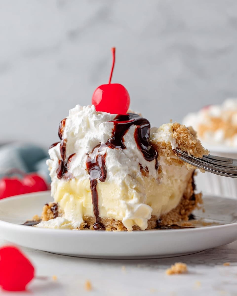 The image shows a slice of creamy dessert on a white plate with a white marbled background. The dessert has three visible layers: the bottom layer is a light brown crumbly crust, the middle layer is thick and creamy pale yellow custard, and the top layer is white whipped cream. Dark brown chocolate syrup is drizzled over the whipped cream, and a bright red cherry sits on top as garnish. A woman's hand holds a fork with a piece of crust and cream near the plate’s right edge. There are a few crumbs and another red cherry on the surface near the plate. Photo taken with an iphone --ar 4:5 --v 7
