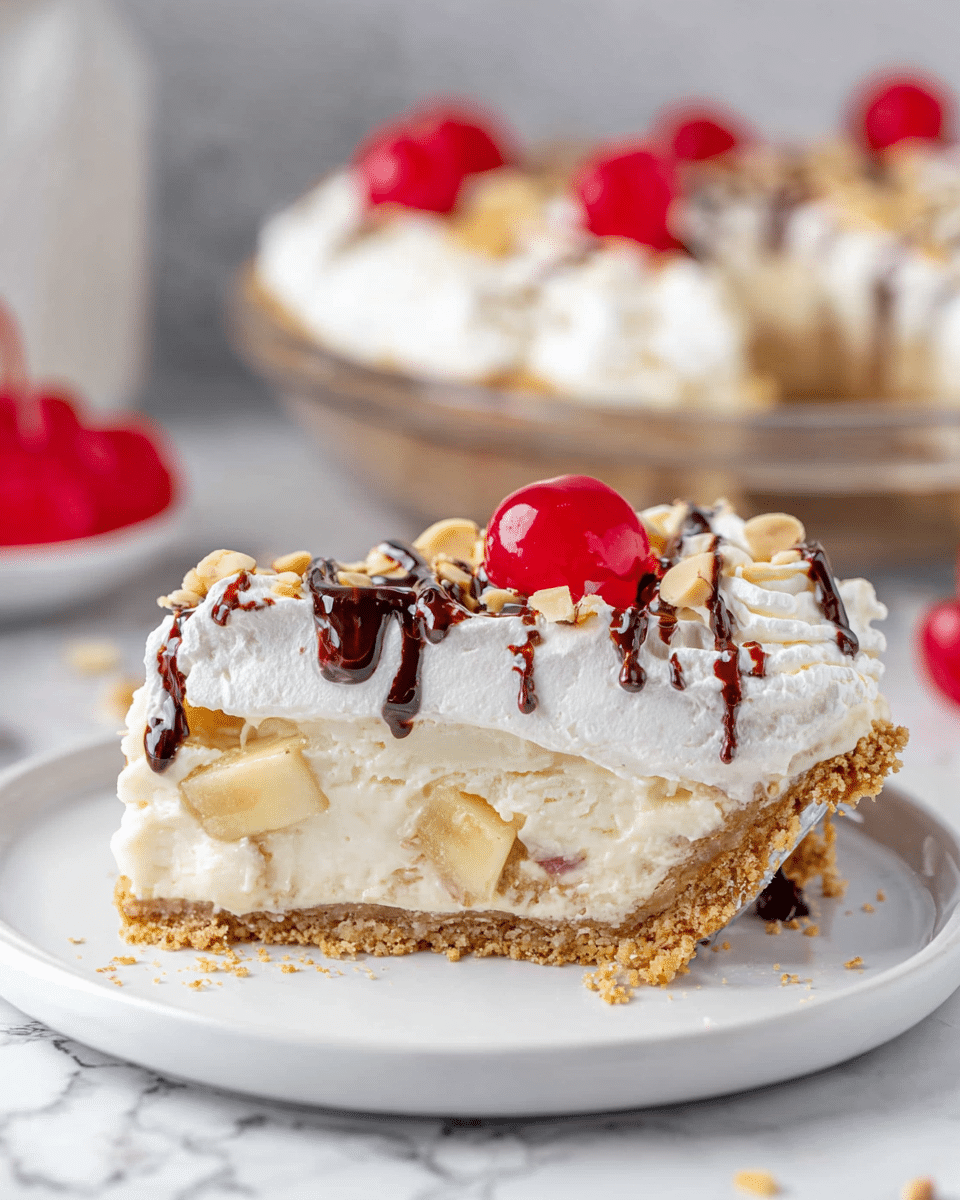 A single slice of pie on a white round plate shows four clear layers: a thick, crumbly light brown crust at the bottom, a dense creamy white layer above it, a chunk-filled pale yellow fruit layer, and a thick, fluffy white topping. The white topping is decorated with a glossy bright red cherry, small chunks of nuts, and thin drizzles of dark chocolate, all on a white marbled surface. In the background, the rest of the pie topped with similar cherries is visible in a clear glass pie dish. Photo taken with an iphone --ar 4:5 --v 7