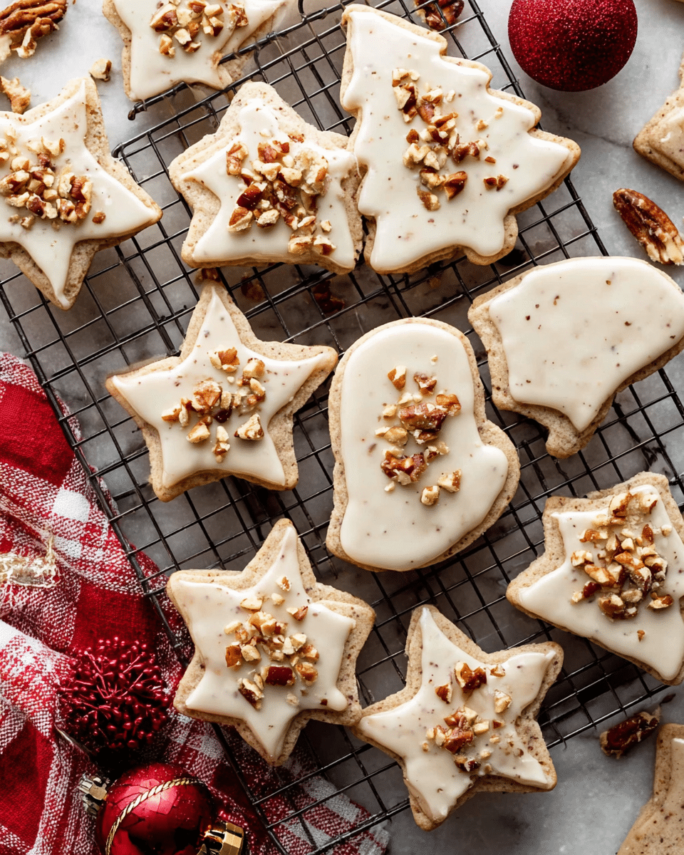On a white marbled surface, a metal cooling rack holds various Christmas-themed cookies shaped like stars, trees, and mittens. Each cookie has a smooth off-white icing layer that shines slightly and covers most of the top. On top of the icing, small chunks of chopped nuts are scattered evenly, adding a rough texture and a mix of brown tones. The cookies have a pale beige color with tiny darker specks, giving them a slightly spotted look. Some cookies are broken, showing their soft insides. Around the rack, small red and white Christmas ornaments and a red and white checkered cloth add a festive touch. Photo taken with an iphone --ar 4:5 --v 7