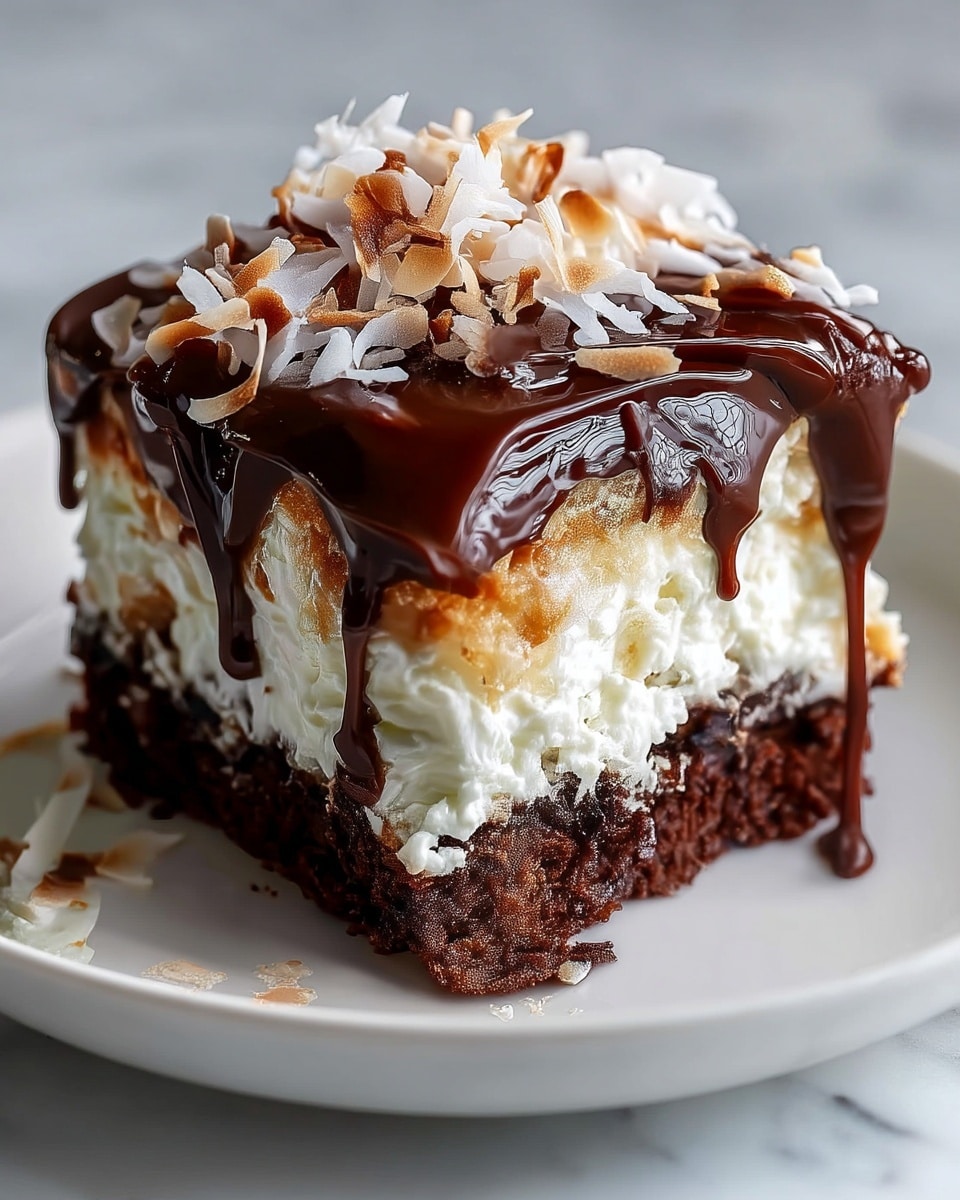 A close-up of a three-layer dessert square on a white plate, set on a white marbled surface. The bottom layer is a dark, moist chocolate cake. The middle layer is thick and fluffy white cream, light and textured with some toasted brown spots on the top edges. The top layer is a glossy, rich dark chocolate ganache that smoothly drips down the sides. On top, there is a generous scattering of toasted white and light brown coconut flakes, adding a slight crunch to the soft cream and chocolate layers. Photo taken with an iphone --ar 4:5 --v 7